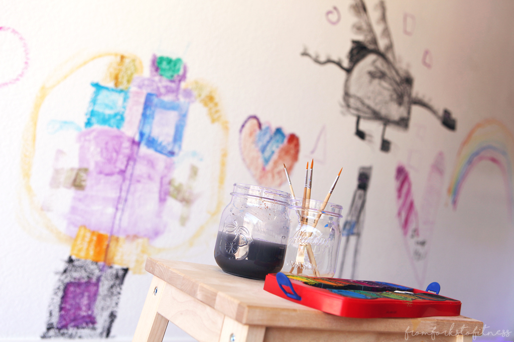 Have piles and piles of kids' doodles and artwork? This kids' art wall might be the answer for you. #montessori #homeschool #kids #painting #ideas #display #decor